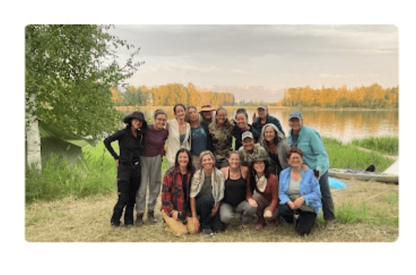 Group photo by the water during autumn